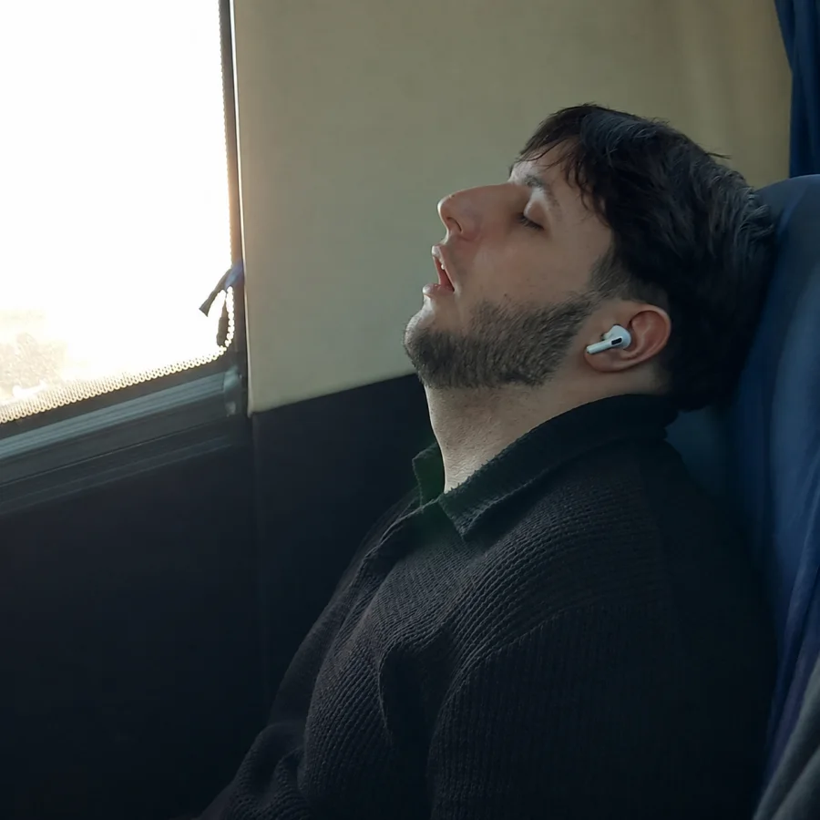 Stefan asleep in a chair by the window